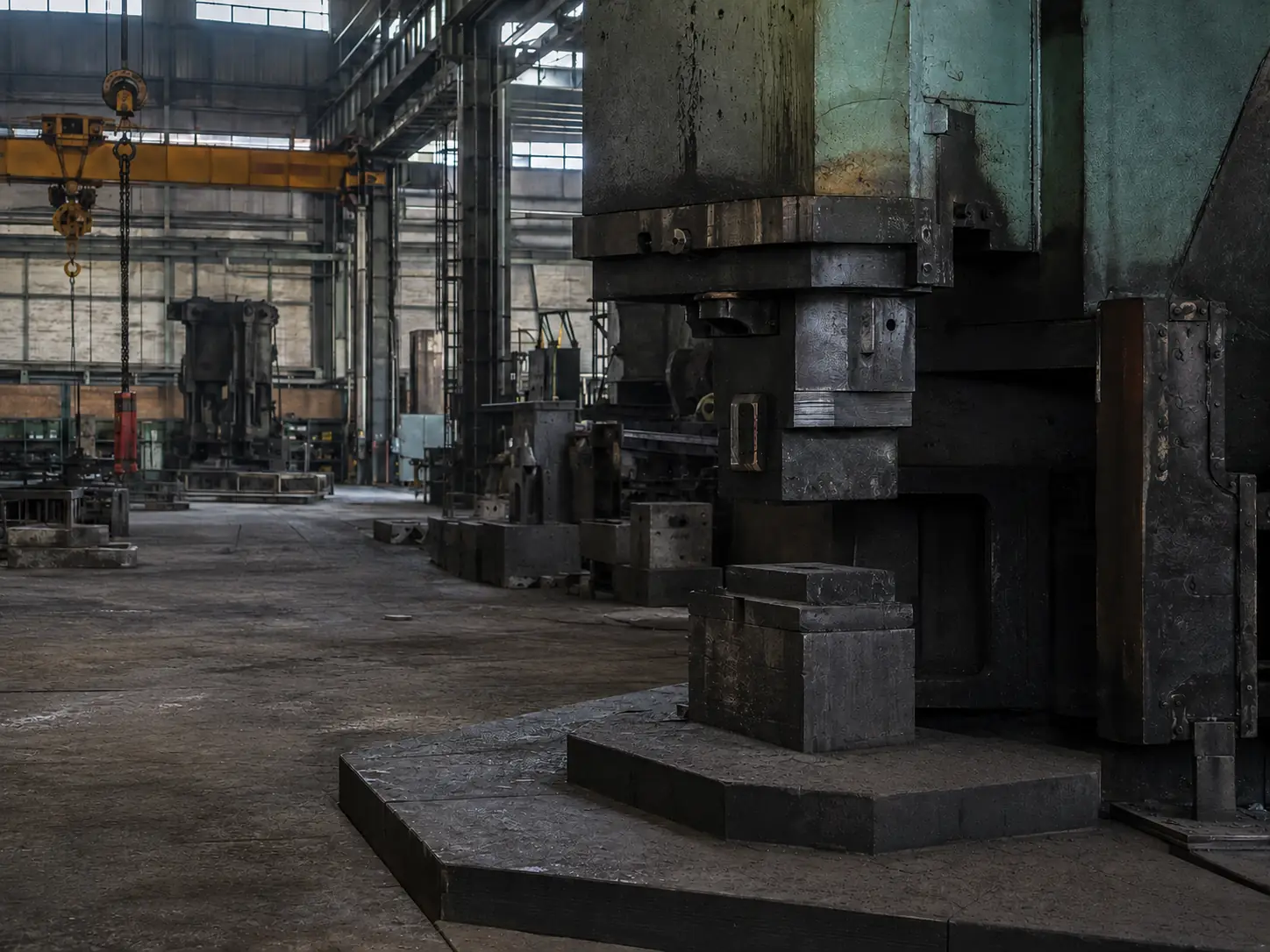 Heavy forming equipment on an industrial factory floor
